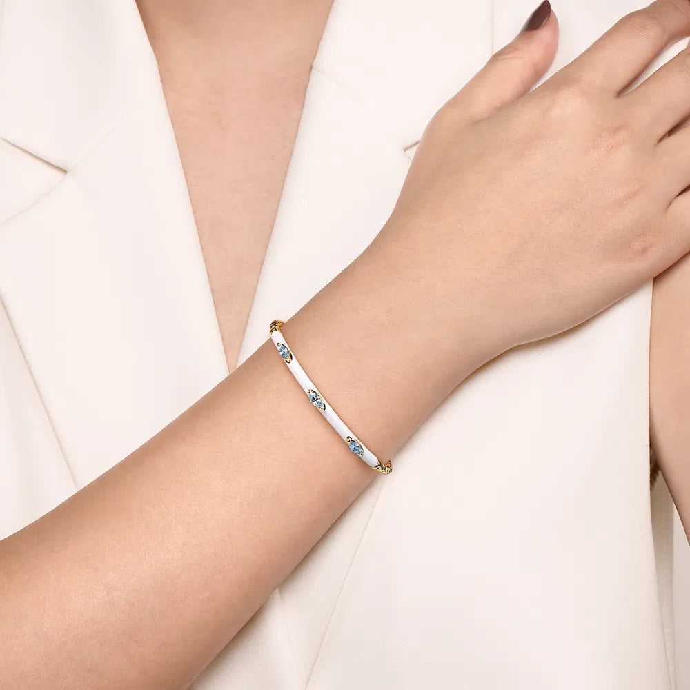Gabriel & Co., 14K Yellow Gold Bujukan Blue Topaz Split Bangle with White Enamel