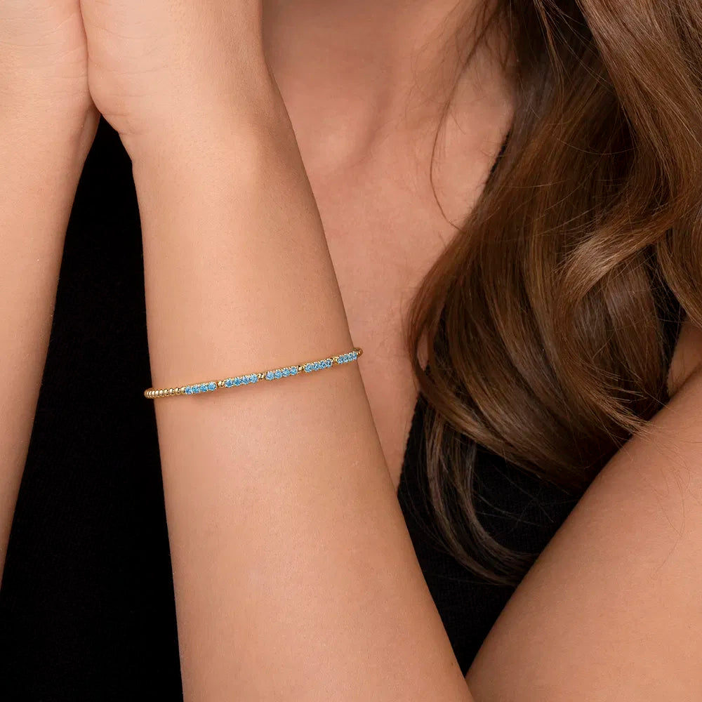 Gabriel & Co., 14K Yellow Gold Bujukan Beads and Blue Topaz Split Bangle Bracelet