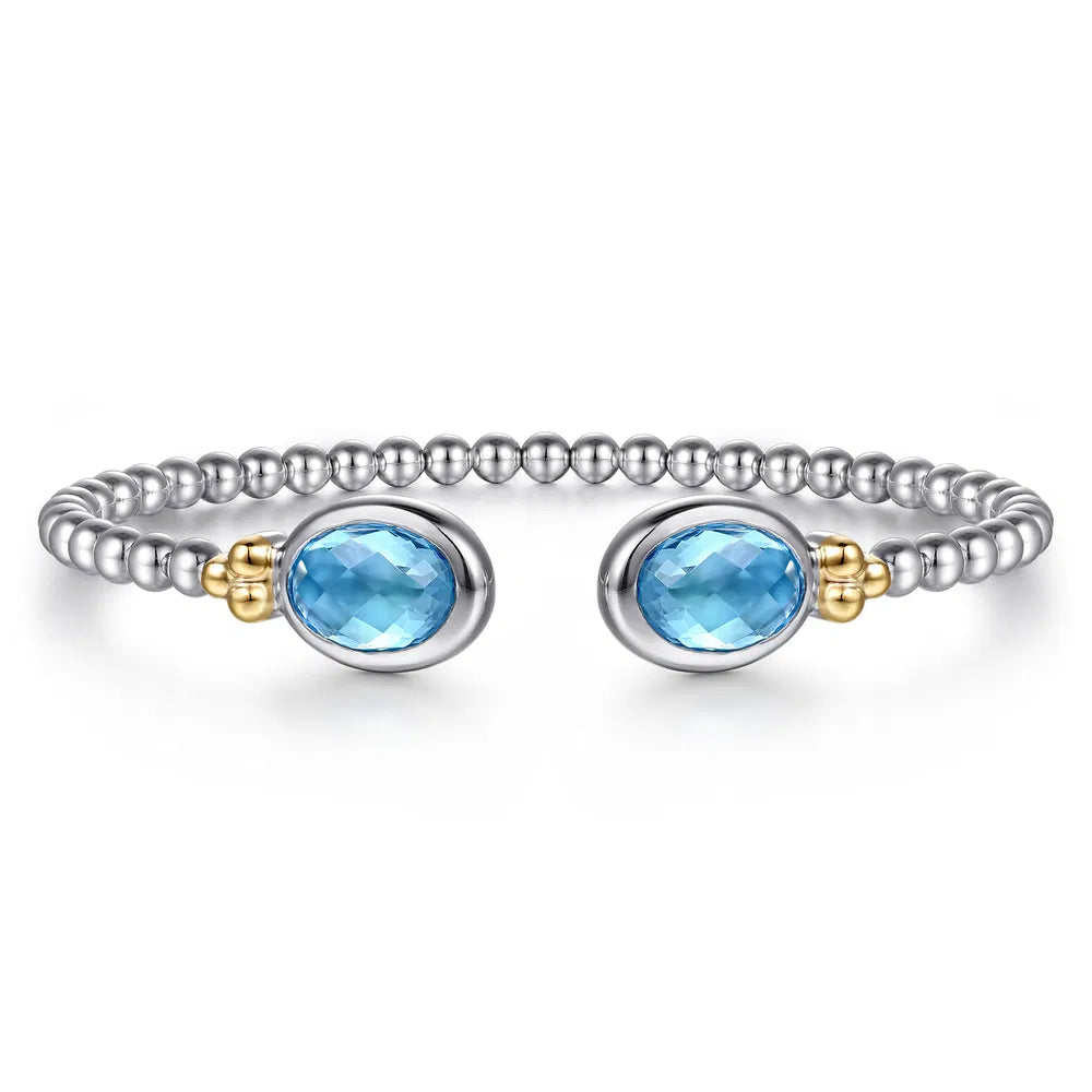Gabriel & Co., 14K Yellow Gold and 925 Sterling Silver Bujukan Oval Blue Topaz Bangle