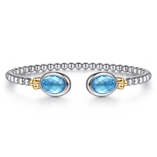 Gabriel & Co., 14K Yellow Gold and 925 Sterling Silver Bujukan Oval Blue Topaz Bangle