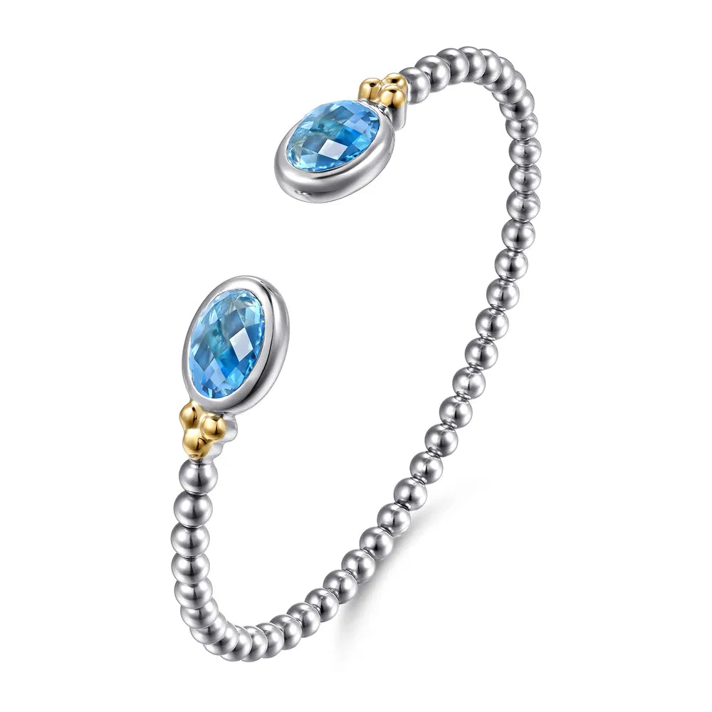 Gabriel & Co., 14K Yellow Gold and 925 Sterling Silver Bujukan Oval Blue Topaz Bangle