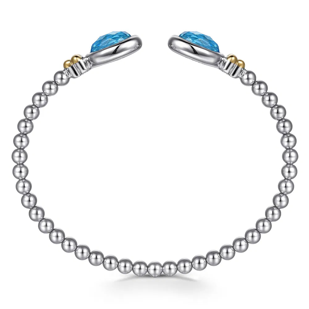 Gabriel & Co., 14K Yellow Gold and 925 Sterling Silver Bujukan Oval Blue Topaz Bangle