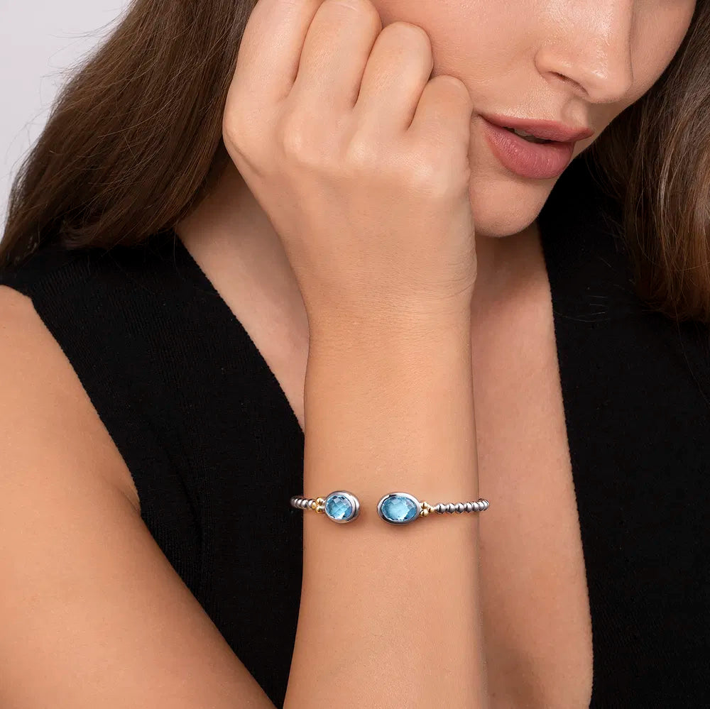Gabriel & Co., 14K Yellow Gold and 925 Sterling Silver Bujukan Oval Blue Topaz Bangle