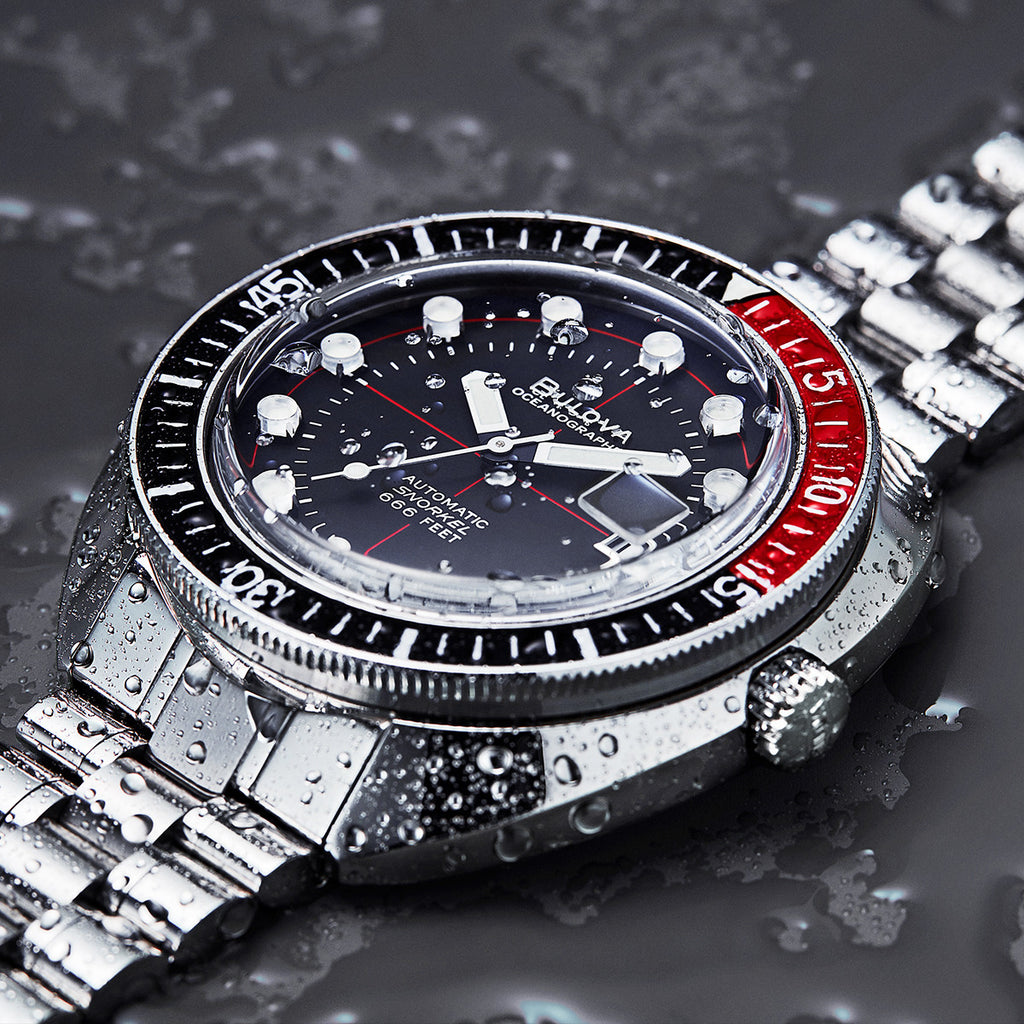 Bulova black top and red watch